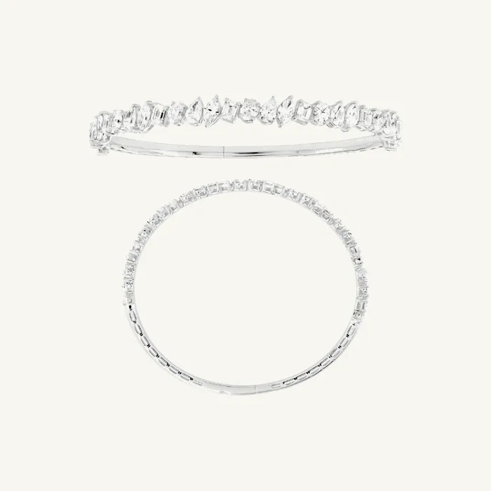Жёсткий браслет с камнями огранки «изумруд» и «круг» · 5.10 ct