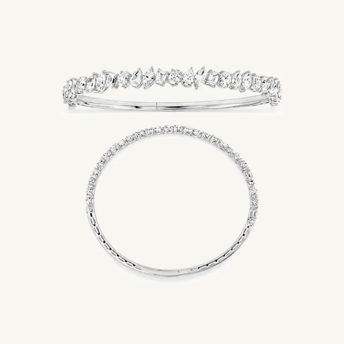 Жёсткий браслет с камнями огранки «изумруд» и «круг» · 5.10 ct